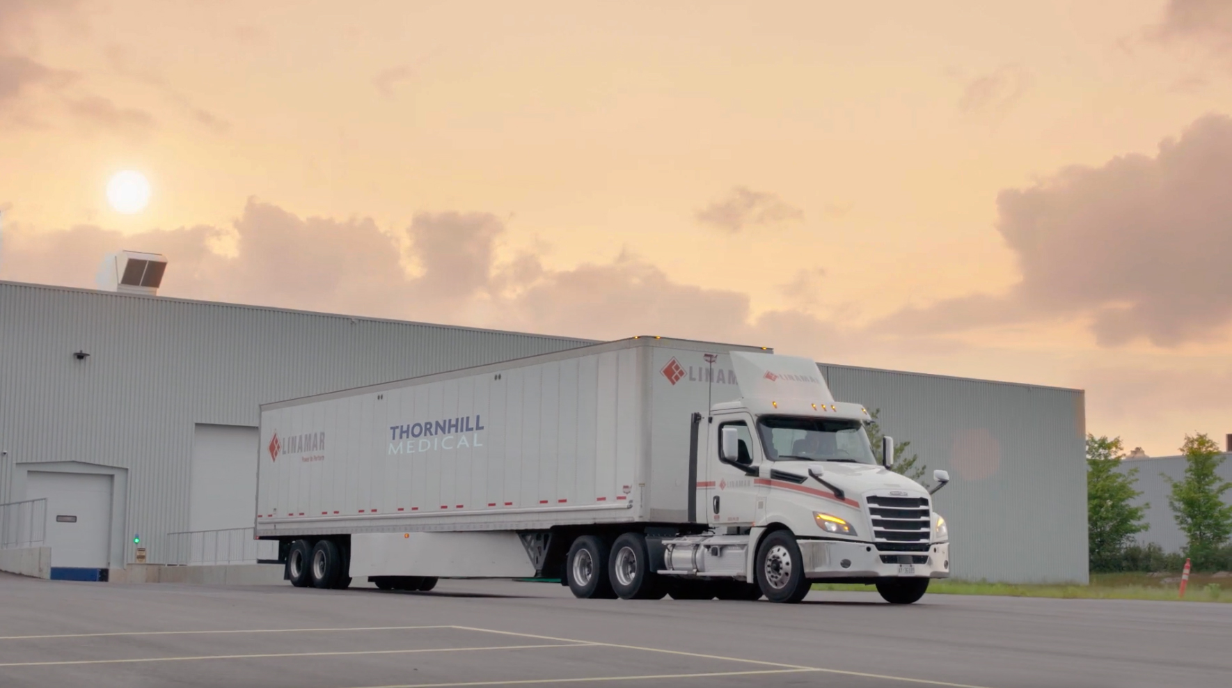 Thornhill Medical truck leaving warehouse at sunrise